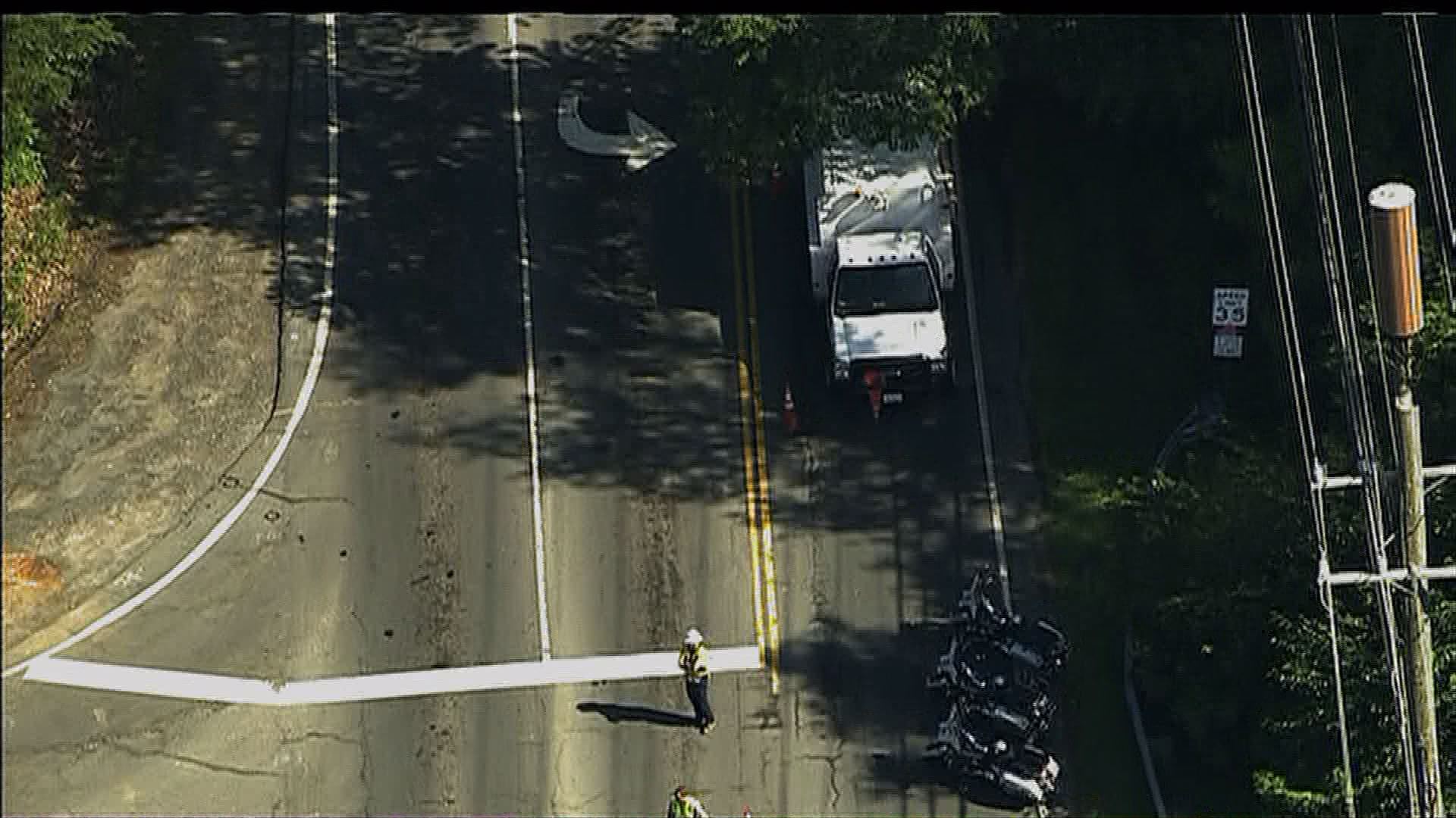 Hunter Mill Rd blocked by trees, poles