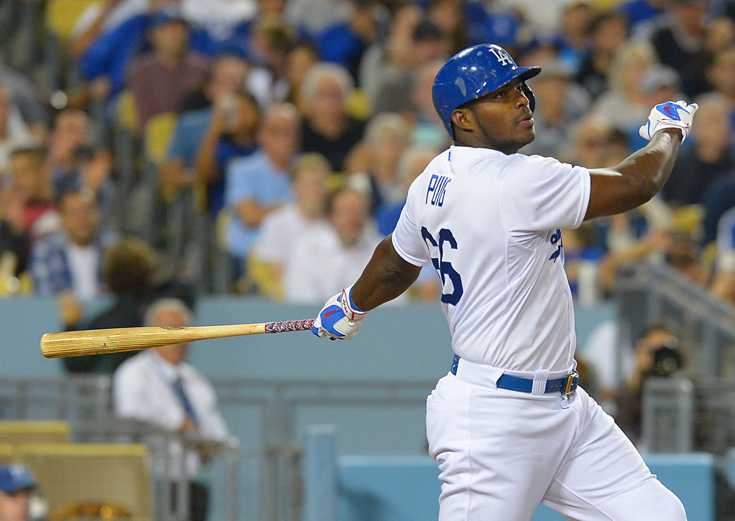 Los Angeles Dodgers' Yasiel Puig, center, Andre Ethier, right, and