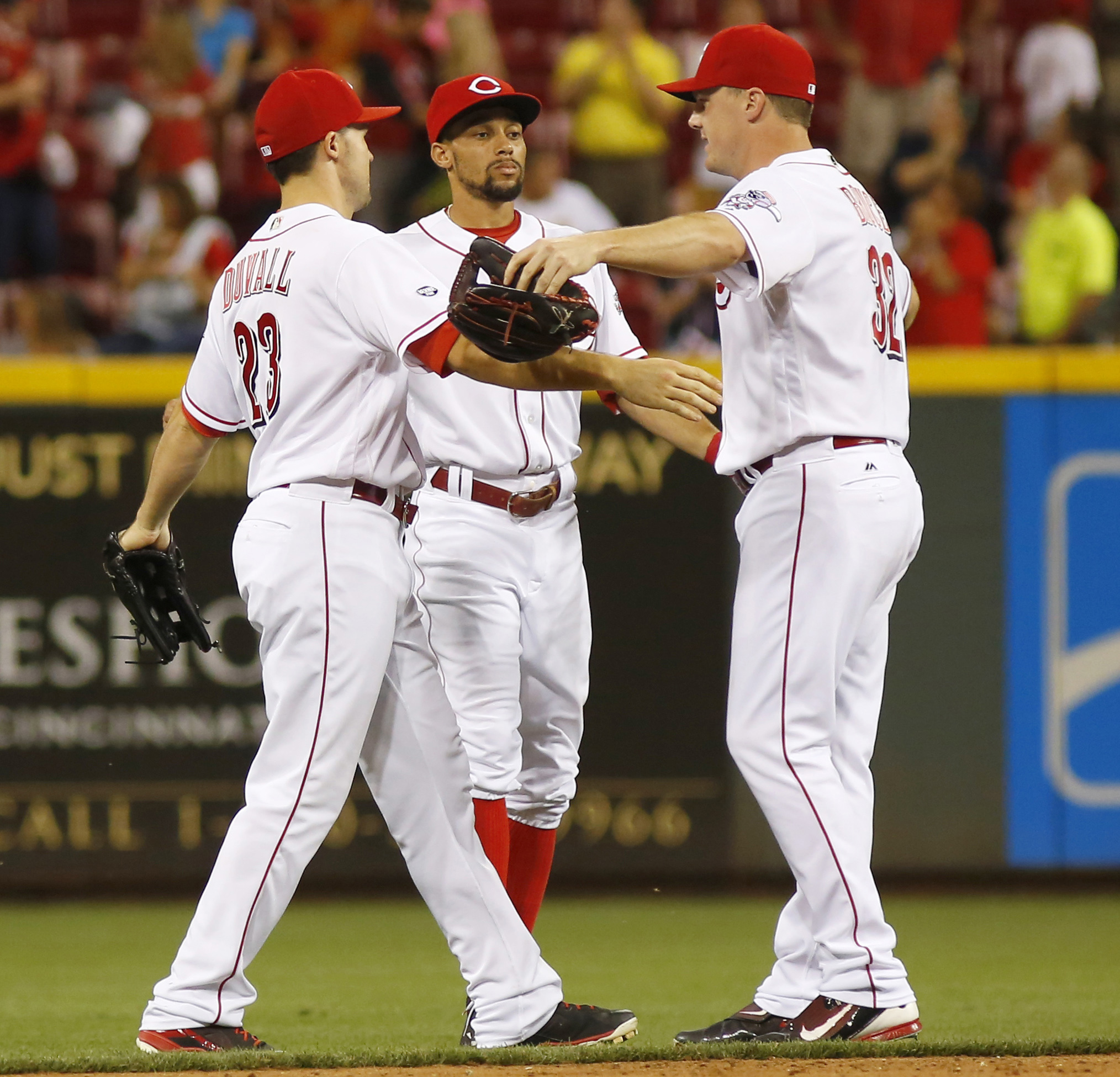 Cincinnati Reds' Billy Hamilton, left, and Eugenio Suarez, right