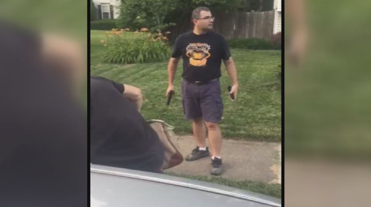 Navy official caught on camera threatening young men with a gun | wkyc.com